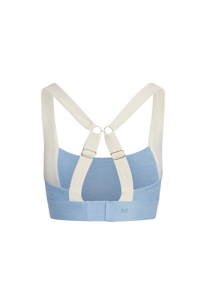 Back view of Tash Bra in heather sky and ivory with crisscross adjustable straps and three-row hook-and-eye on white background