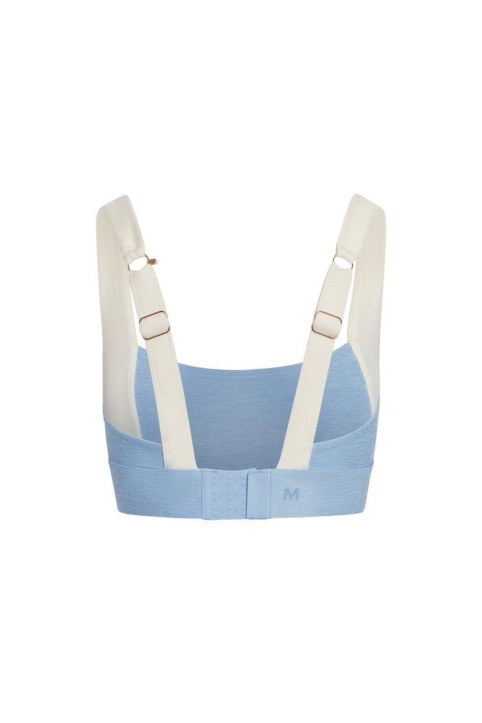 Back view of Tash Bra in Heather Sky and Ivory with wide adjustable straps, three-row hook-and-eye, and heather blue band on white background