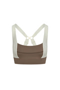 Back view of Tash Bra in stone and ivory jersey showcasing cross-back straps and gold ring hardware on white background