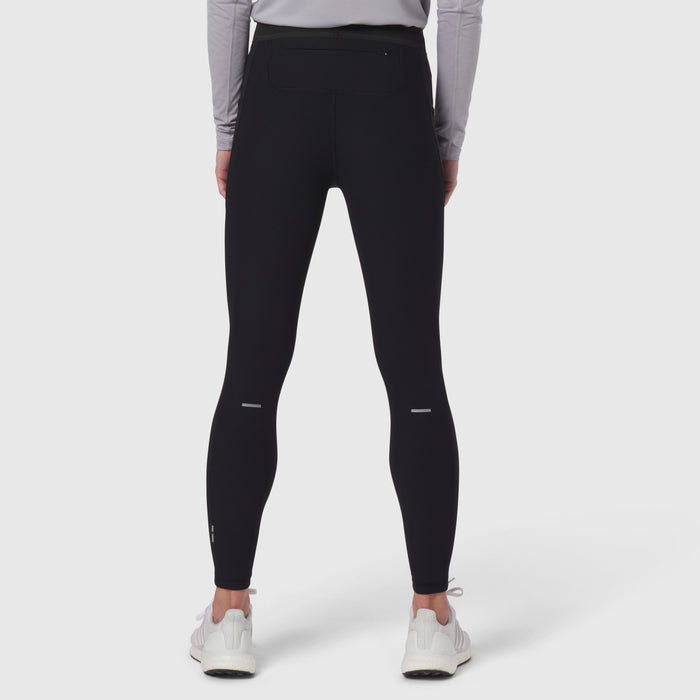 Black Lycra Ribbed Running Tight worn by model from behind, showing fitted silhouette and reflective details