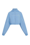 Front view of Westmount Jacket in Sky Nylon showcasing cropped fit, zip front, hood, elastic cinch hem on white background