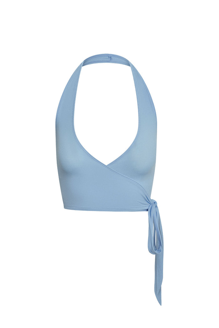 Front view of Yosemite Sleeveless Top in sky lightweight rib showing halter neckline, wrap front and side tie on white