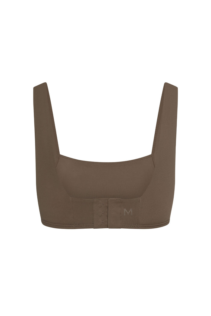 Back view of Zion bra in stone showing adjustable three-hook back closure on white background